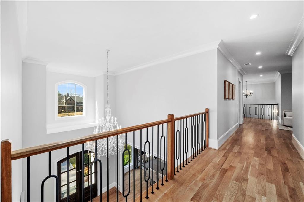 1002 Overlook Terrace Ball Ground, GA 30107 - Photo 49 of 100 a view of a hallway with wooden floor and windows