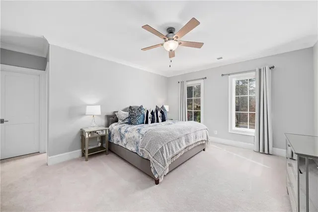 a view of sign board with yard and tree