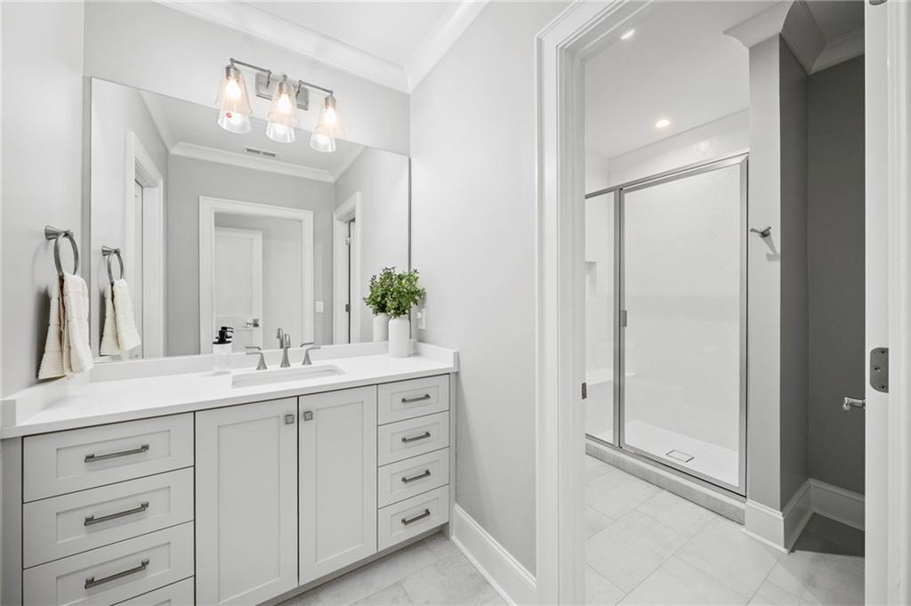 1002 Overlook Terrace Ball Ground, GA 30107 - Photo 53 of 100 a bathroom with a double vanity sink mirror and