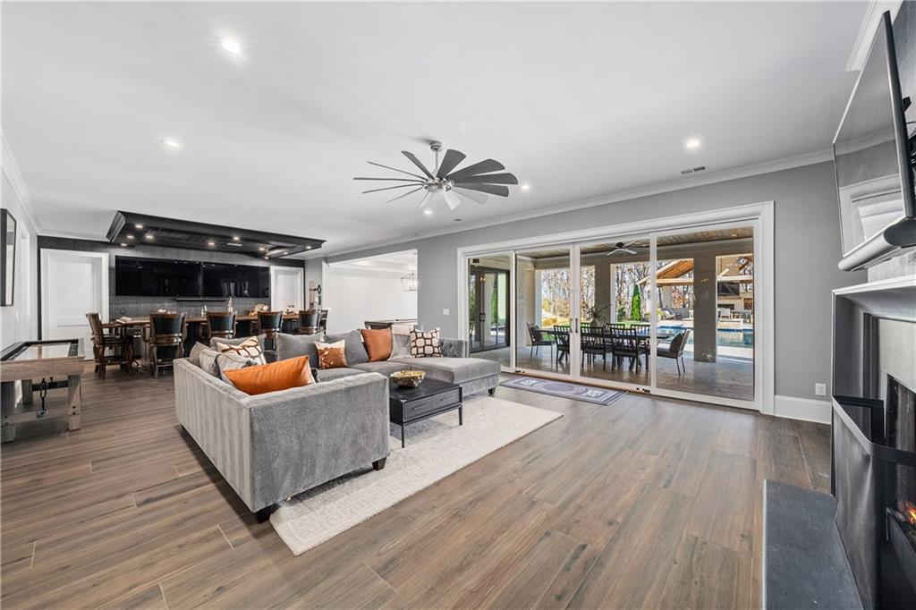 1002 Overlook Terrace Ball Ground, GA 30107 - Photo 60 of 100 a living room with furniture and a flat screen tv