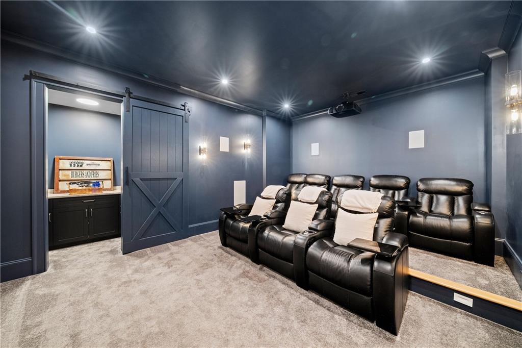 1002 Overlook Terrace Ball Ground, GA 30107 - Photo 6 of 100 a projector room with furniture