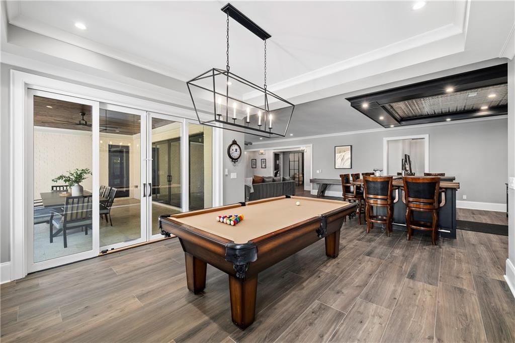 1002 Overlook Terrace Ball Ground, GA 30107 - Photo 65 of 100 a room with furniture pool table flat screen tv and a chandelier