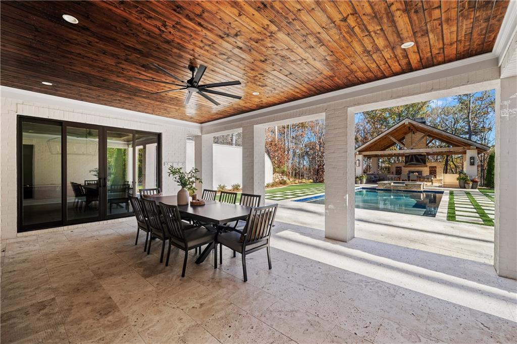 1002 Overlook Terrace Ball Ground, GA 30107 - Photo 79 of 100 a view of a patio with a dining table and chairs