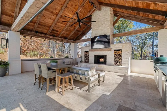 a living room with furniture fireplace and flat screen tv