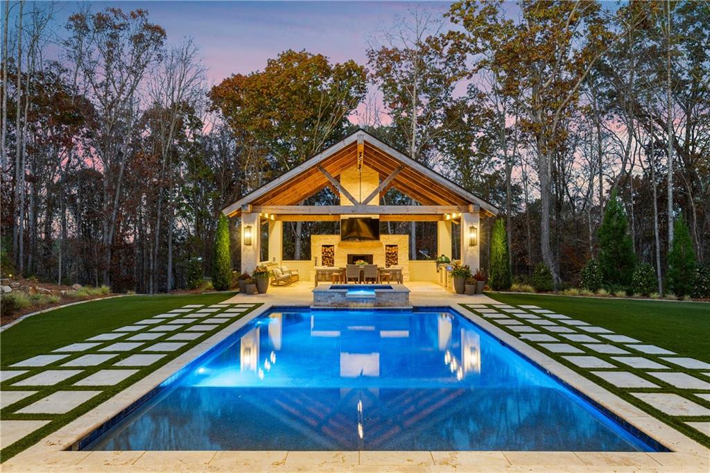 1002 Overlook Terrace Ball Ground, GA 30107 - Photo 9 of 100 a view of a house with swimming pool
