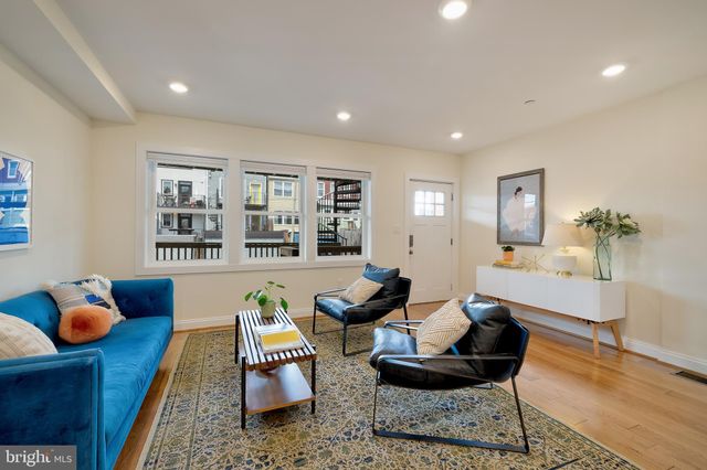 a living room with furniture and window