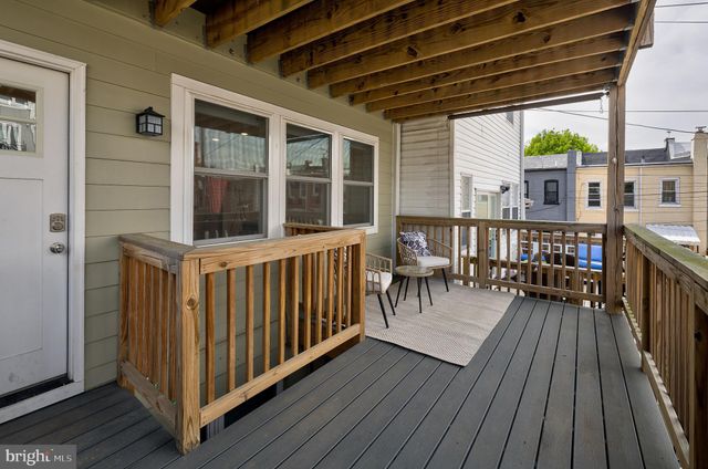 a view of a house with wooden deck