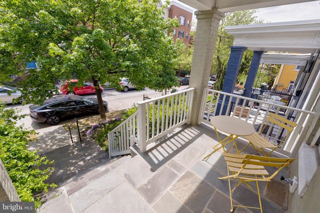 a view of balcony with furniture