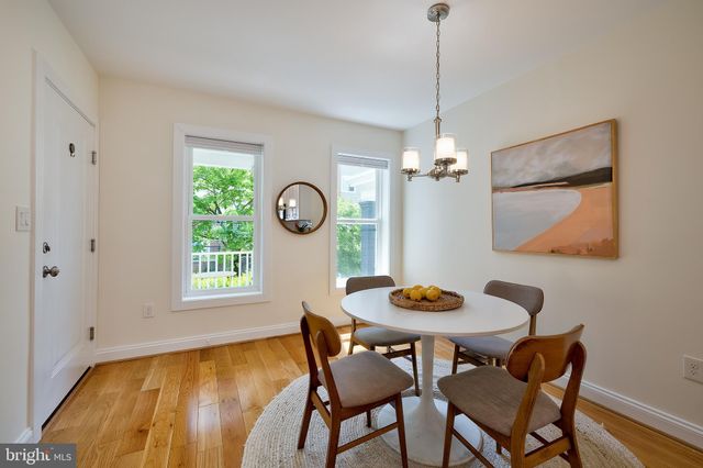 a view of a dining room with furniture and window