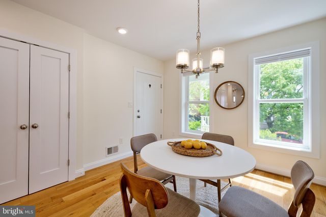 a view of a dining room and a table