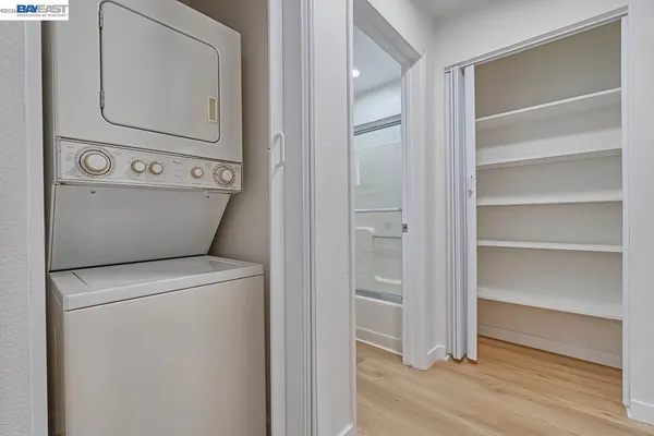 a kitchen with stainless steel appliances a sink stove and refrigerator