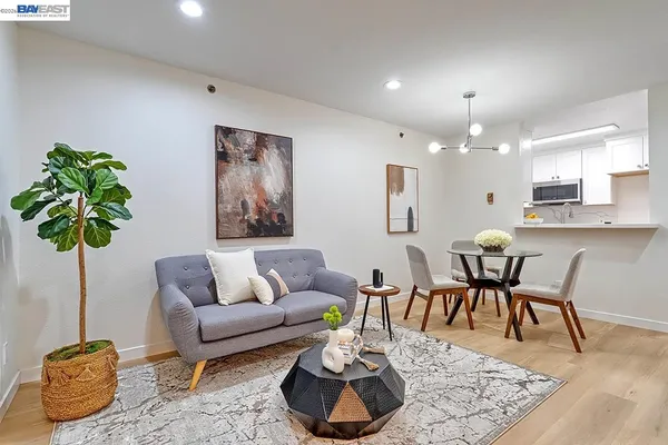 a stove top oven sitting inside of a kitchen