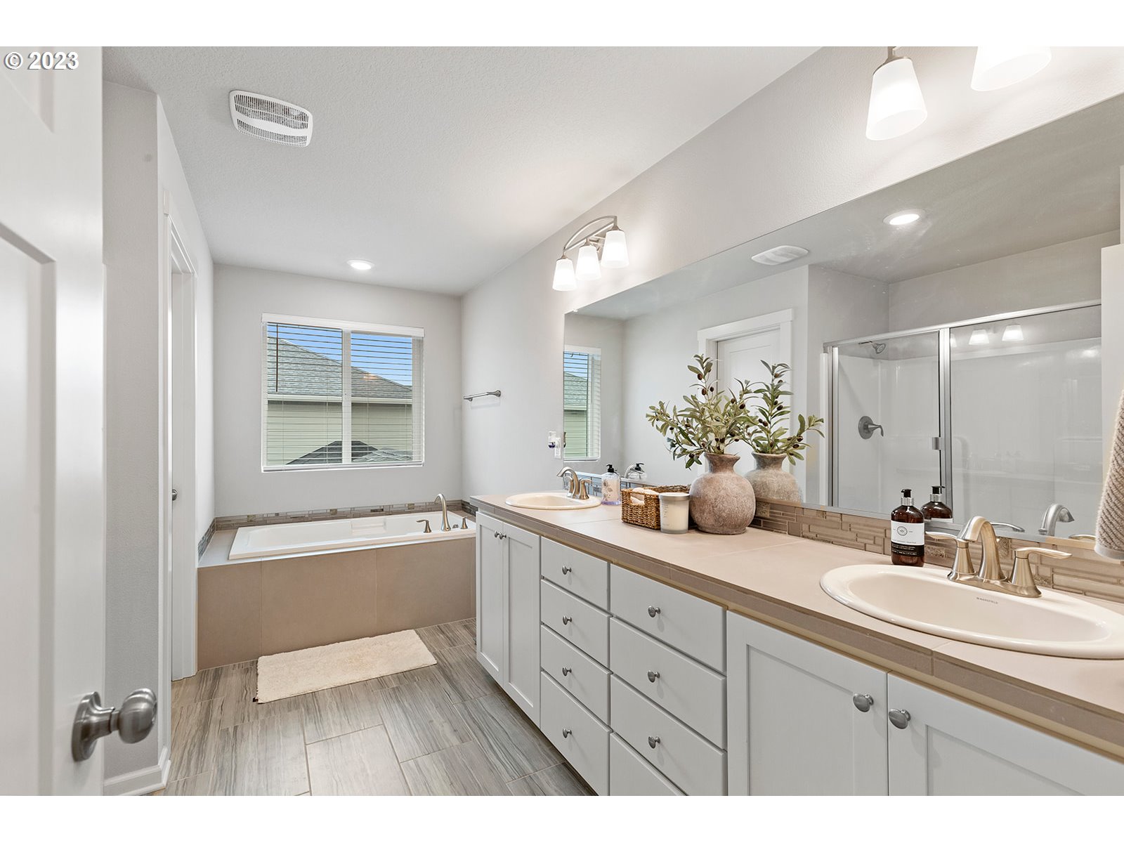 3722 South 39th Place Ridgefield, WA 98642 - Photo 29 of 45 a spacious bathroom with a granite countertop sink mirror and a