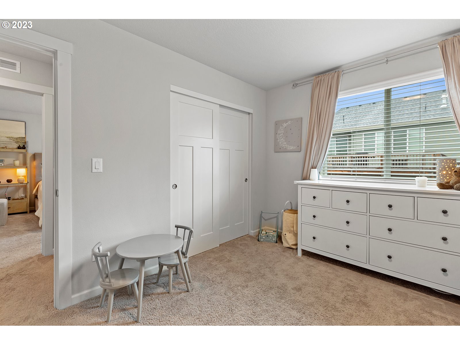 3722 South 39th Place Ridgefield, WA 98642 - Photo 38 of 45 a bedroom with a bed and a table in it