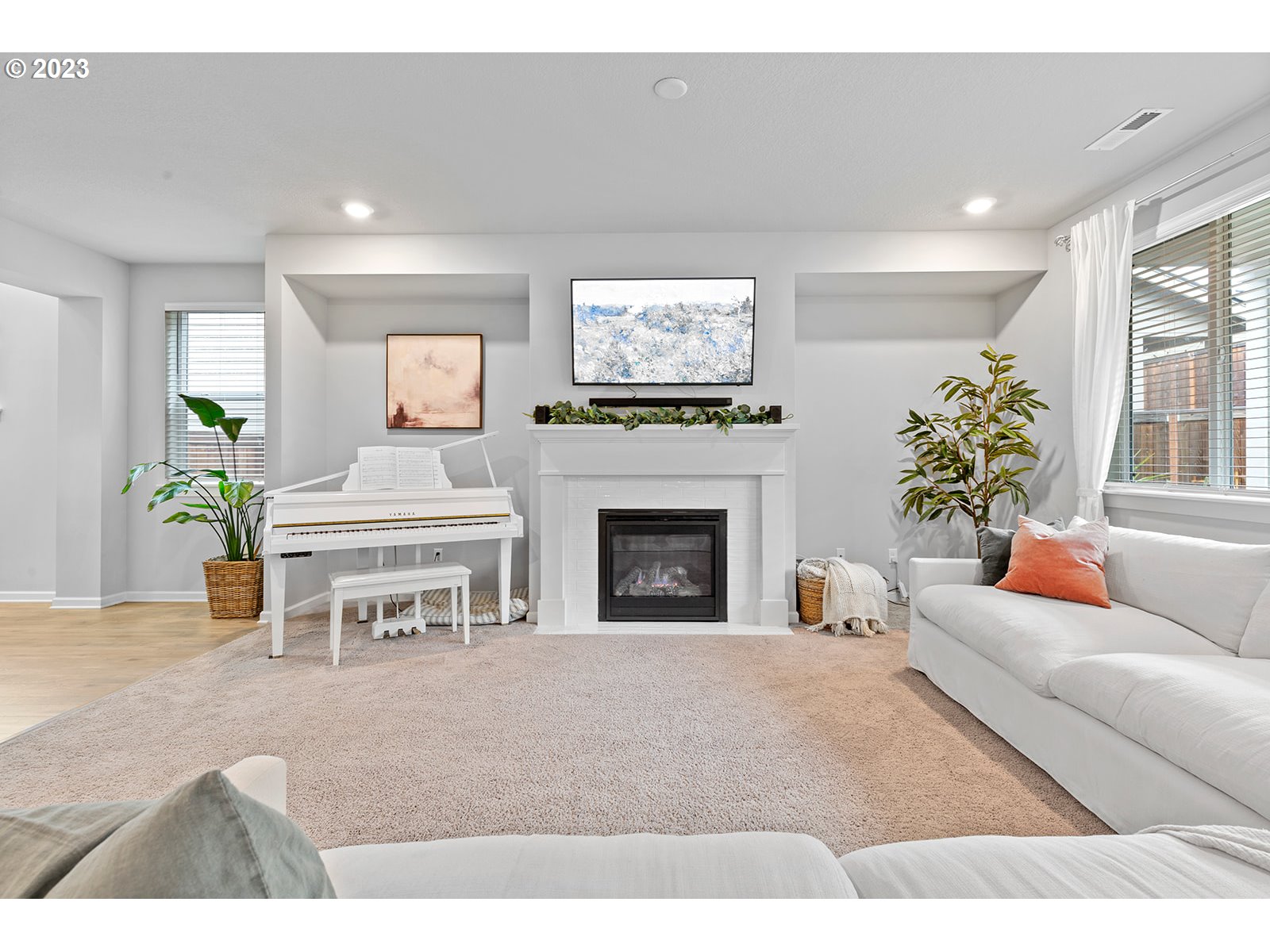 3722 South 39th Place Ridgefield, WA 98642 - Photo 7 of 45 a living room with furniture a fireplace and a flat screen tv