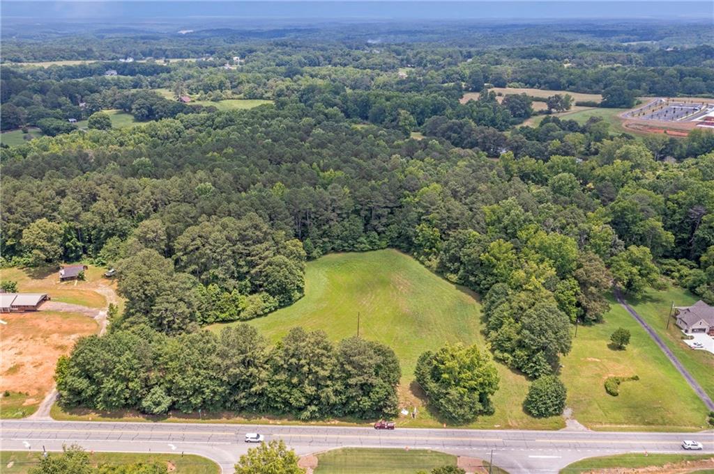 0 Cumming Highway Canton, GA 30115 - Photo 1 of 14 an aerial view of a residential houses covered with trees