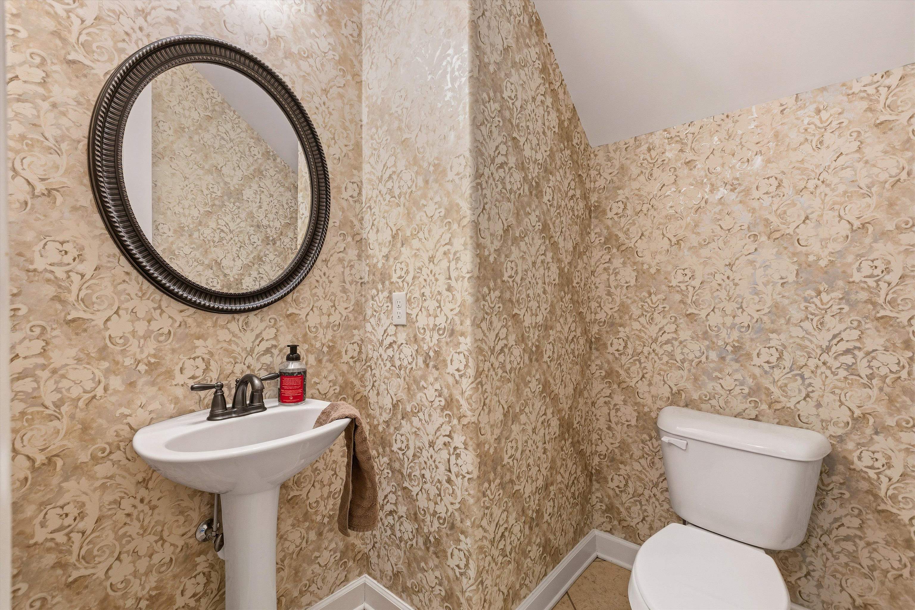 141 Lower Fields Lane Collierville, TN 38017 - Photo 12 of 29 Downstairs for guests with beautiful wallpaper!