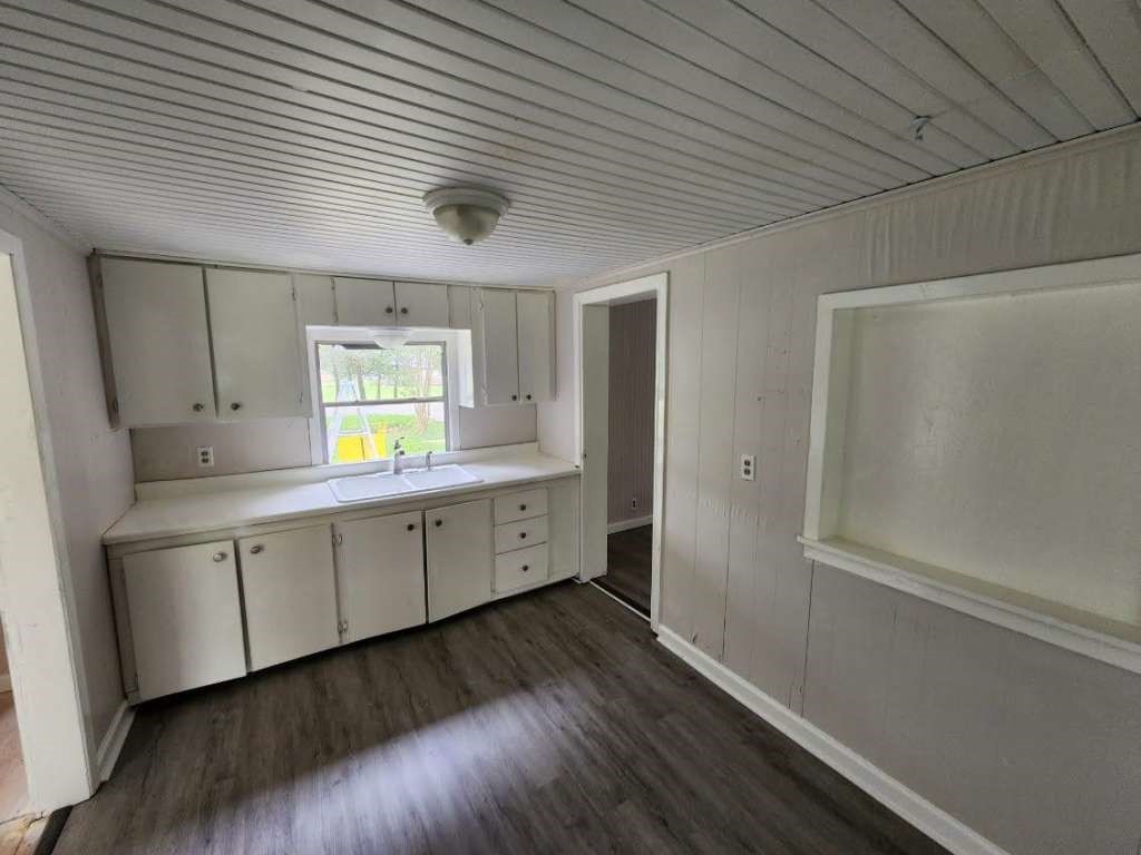 1329 Adams Road Bay City, TX 77414 - Photo 5 of 14 a view of a kitchen with wooden floor