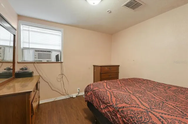 a bedroom with a bed and furniture