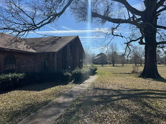a view of a barn with a yard