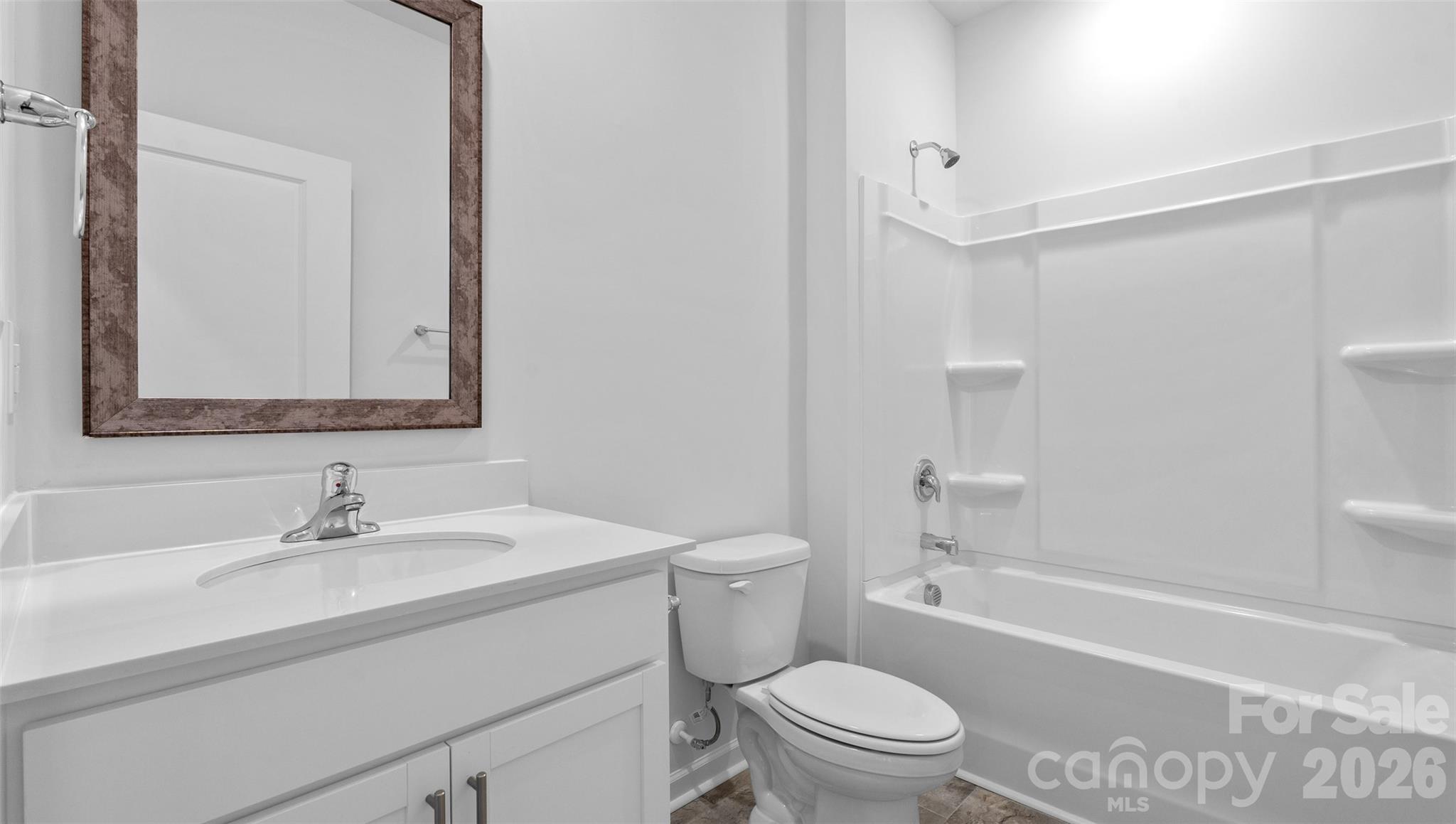 107 Bovine Br Road Fletcher, NC 28732 - Photo 11 of 20 a bathroom with a sink a toilet and shower