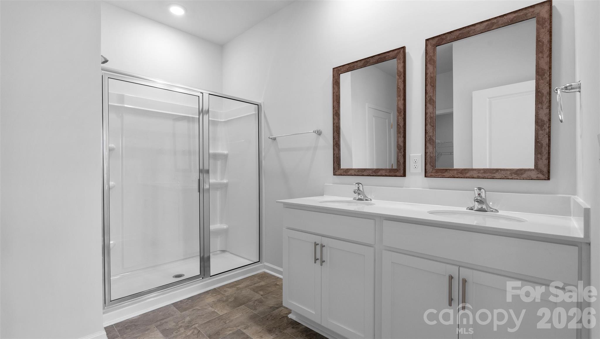 107 Bovine Br Road Fletcher, NC 28732 - Photo 12 of 20 a bathroom with double sink and a mirror