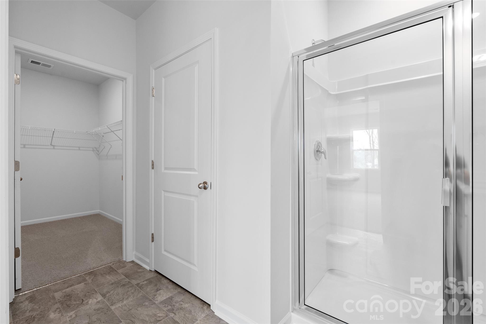 107 Bovine Br Road Fletcher, NC 28732 - Photo 17 of 20 a bathroom with a glass shower door