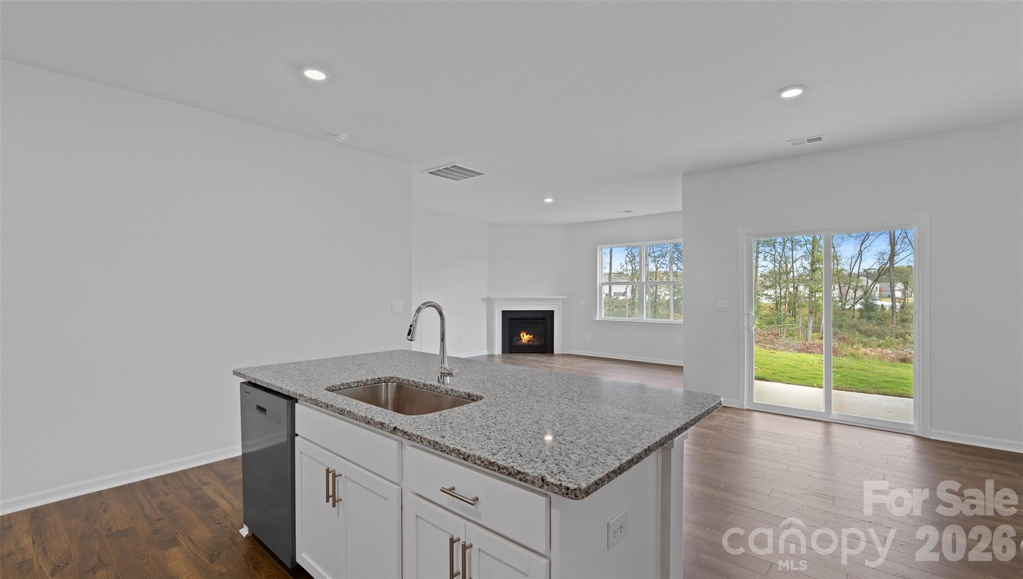 107 Bovine Br Road Fletcher, NC 28732 - Photo 5 of 20 a kitchen with granite countertop a sink and a stove