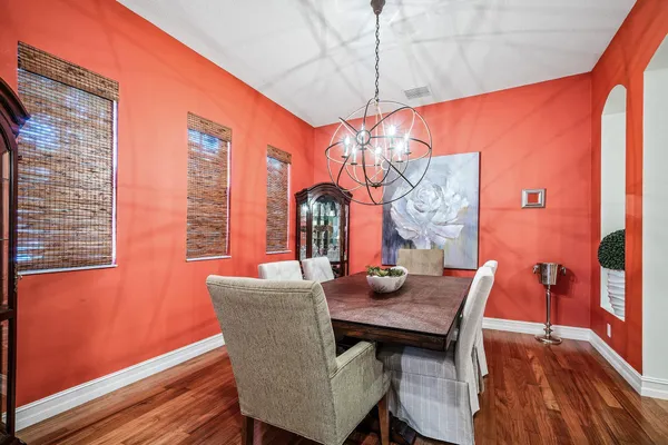 a dining room with furniture and window