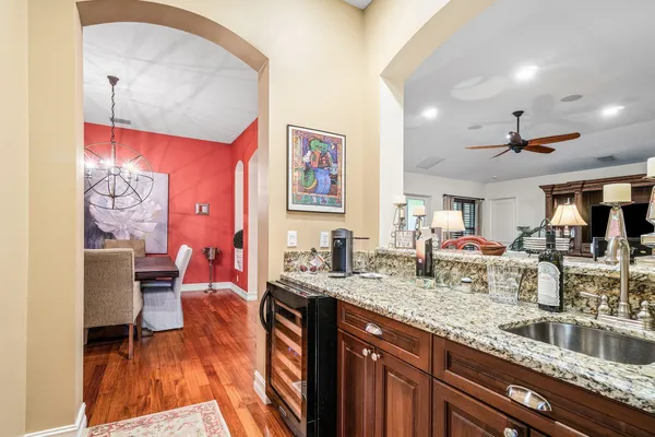 a kitchen with stainless steel appliances kitchen island granite countertop a sink and cabinets