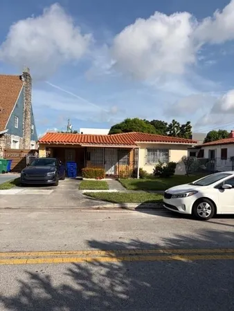 a car parked in front of a house