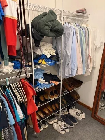a bedroom with a bed and a walk in closet