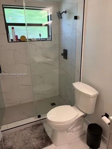 a bathroom with a sink vanity and a mirror