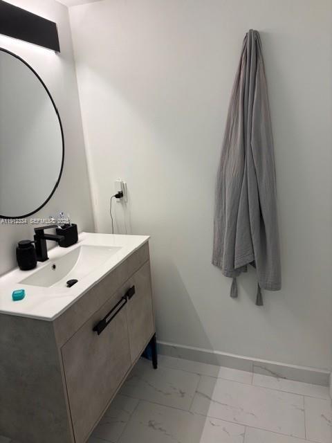 1911 Southwest 23rd Street Miami, FL 33145 - Photo 17 of 25 a bathroom with a sink vanity and a mirror