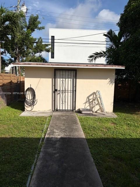 1911 Southwest 23rd Street Miami, FL 33145 - Photo 19 of 25 a view of a backyard with a garden and plants