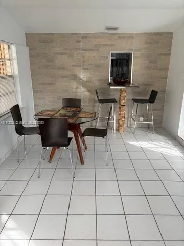 a living room with a fireplace furniture and a flat screen tv