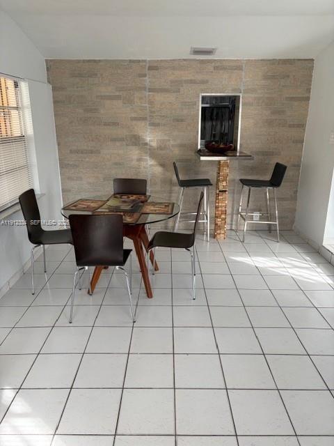 1911 Southwest 23rd Street Miami, FL 33145 - Photo 2 of 25 a living room with furniture a flat screen tv and a fireplace