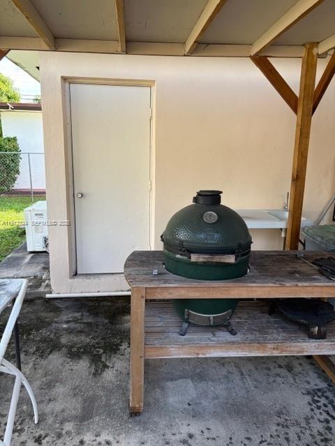 1911 Southwest 23rd Street Miami, FL 33145 - Photo 21 of 25 a room with a table and a potted plant