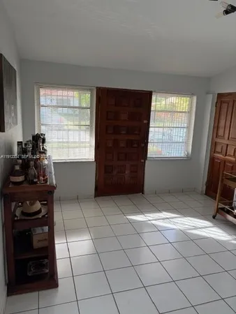 a view of an empty room and window