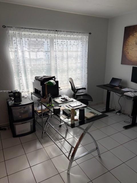 1911 Southwest 23rd Street Miami, FL 33145 - Photo 7 of 25 a living room with furniture and a floor to ceiling window