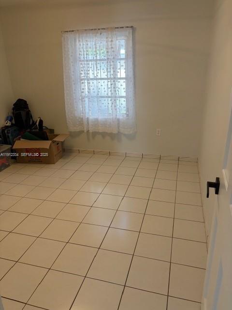 1911 Southwest 23rd Street Miami, FL 33145 - Photo 9 of 25 a room with a window