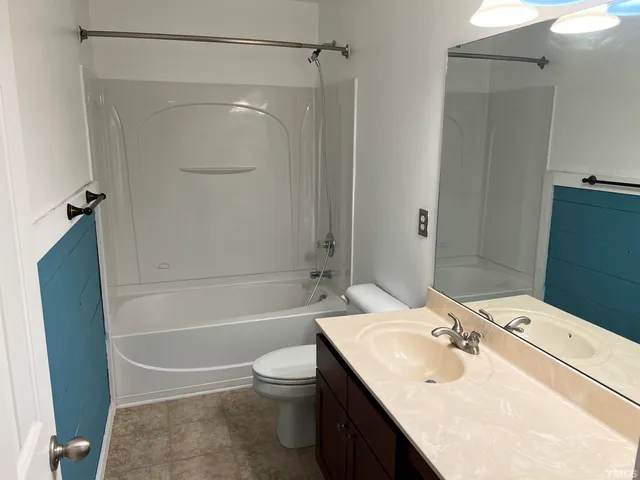 a view of wooden floor and windows in a room