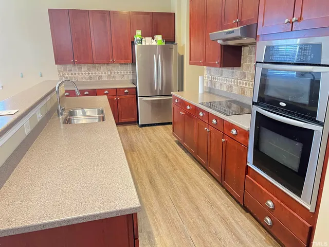 a bathroom with a sink double vanity and a mirror