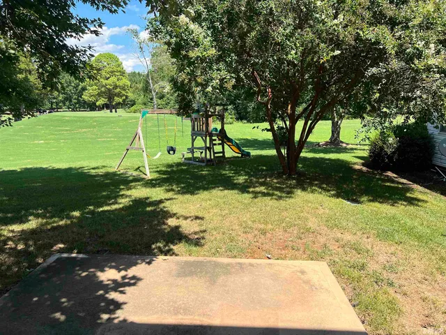 a view of a trees with a yard