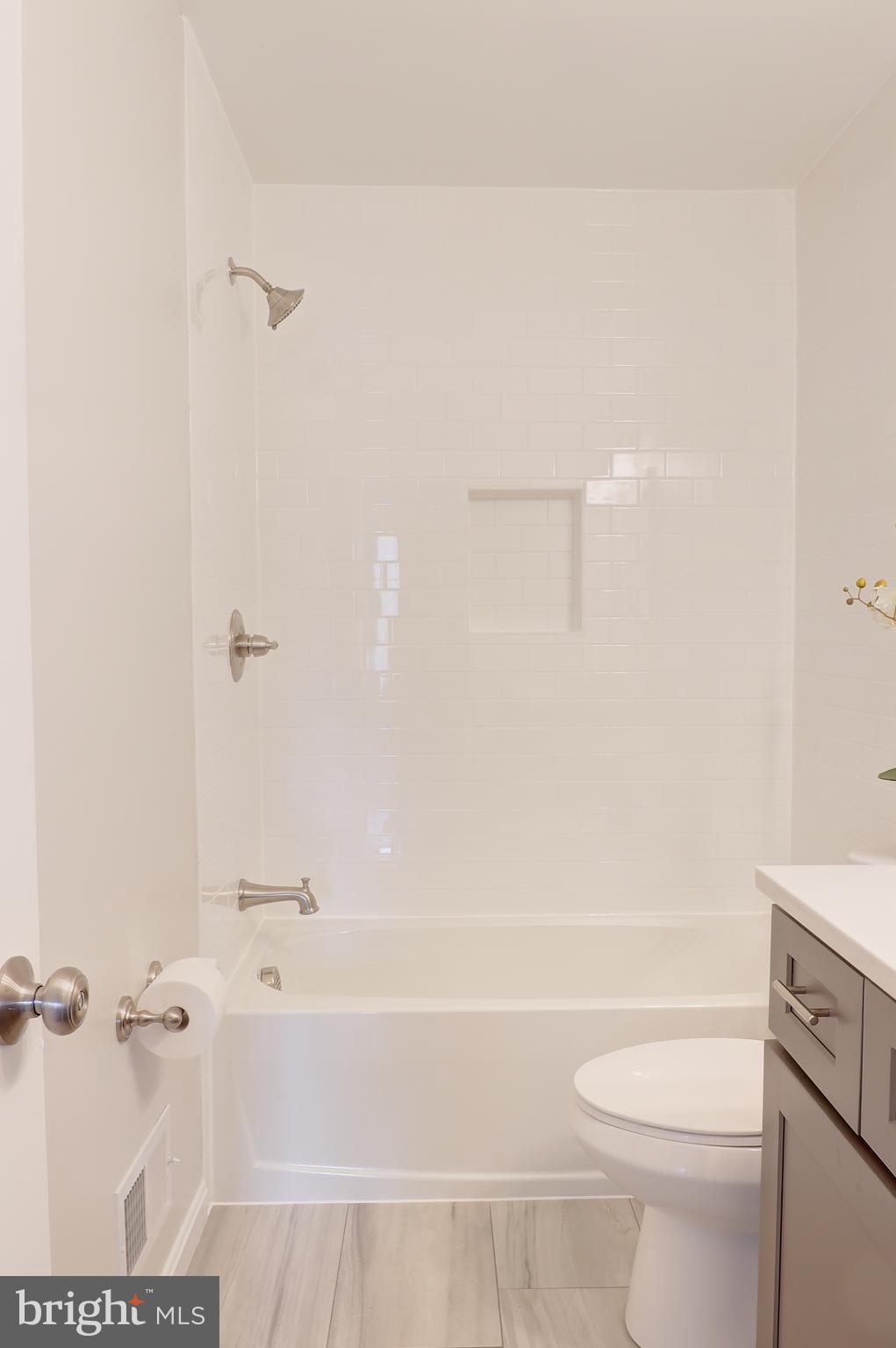 695 Hillmeade Road Edgewater, MD 21037 - Photo 26 of 28 a bathroom with a toilet and a bathtub