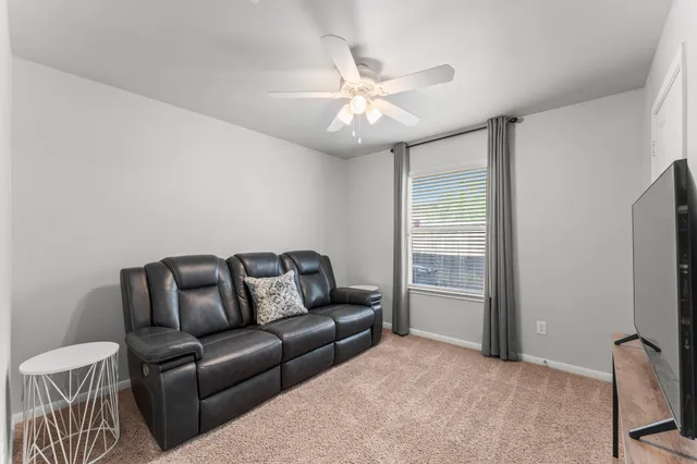 a living room with furniture and a window