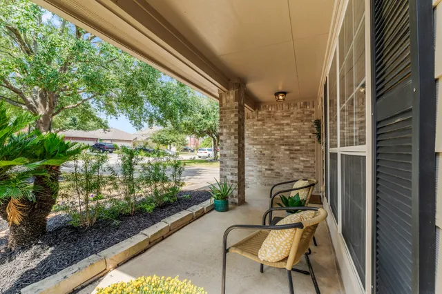 a balcony view with a couple of chairs
