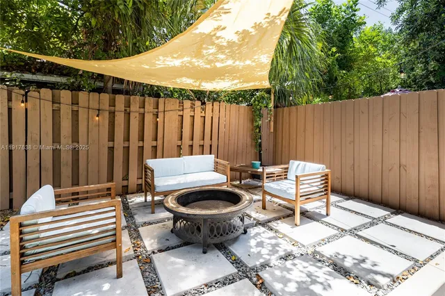 a outdoor space with a couch and chairs