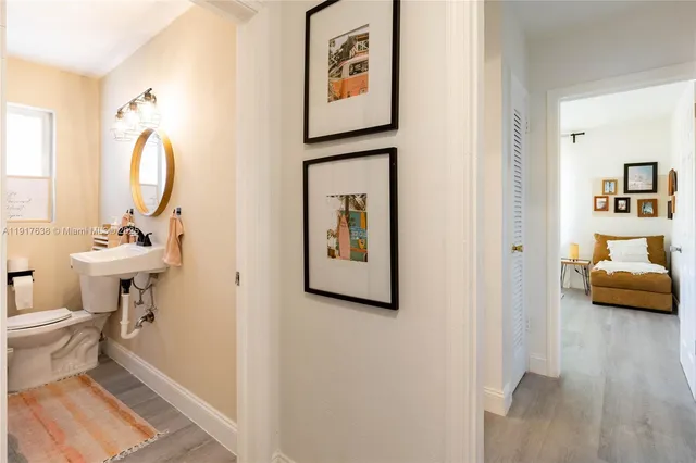 a bathroom with a toilet sink and tub