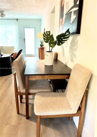 a view of table and chair with potted plant